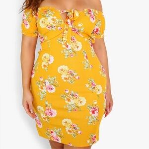 Yellow peasant style mini dress floral, print, and off the shoulder sleeves.